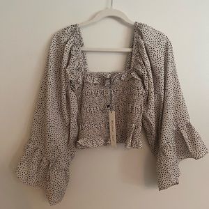 Smocked crop top with bell sleeves
